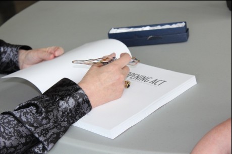 Susan signing a book